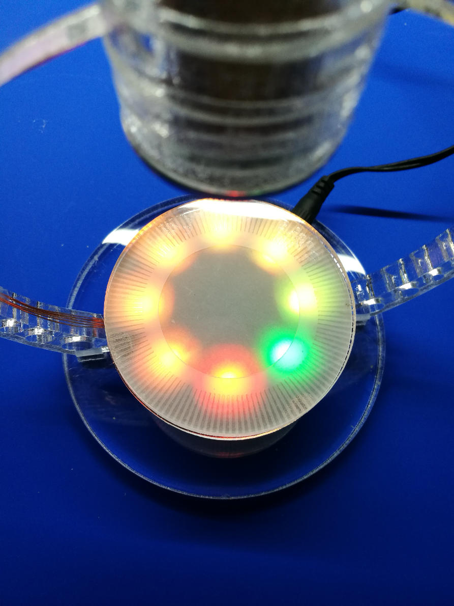 An optical diffusor is used as a spacer. The diffusor is a piece of transparent paper ( laser cut ) between two acylic disks. 